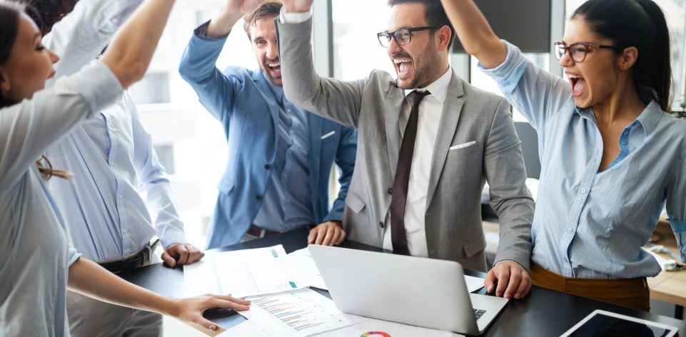 business-team-celebrating-a-good-job-in-the-office